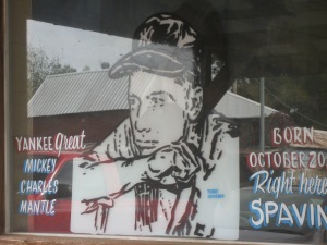 Store front window in Spavinaw, Oklahoma. The only visible indicator that mantle was born there
