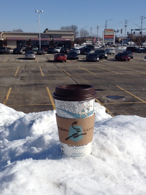 Caribou Coffee cup high atop 'Mount Dekalb' with Caribou location in background