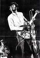 Chuck Berry with Clarence Clemons in background, from 4-28-73 concert, University of Maryland
